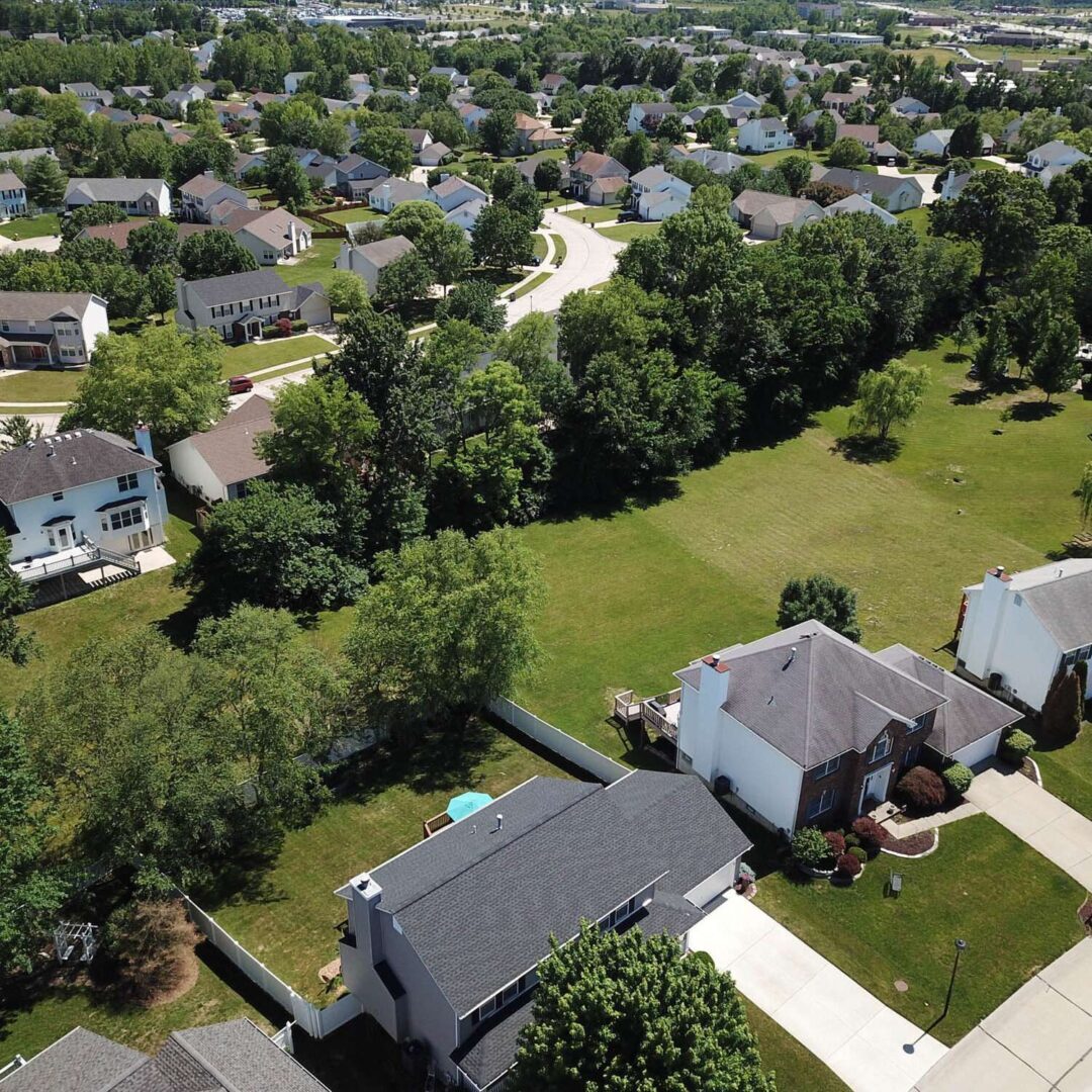 A bird 's eye view of houses and trees.